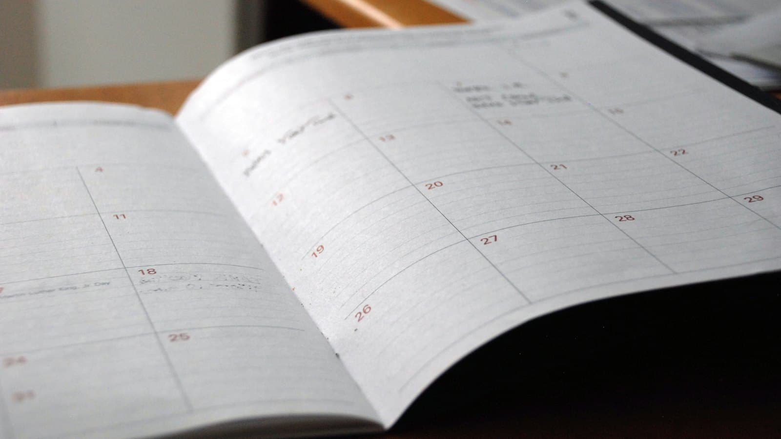 Open monthly planner on a desk