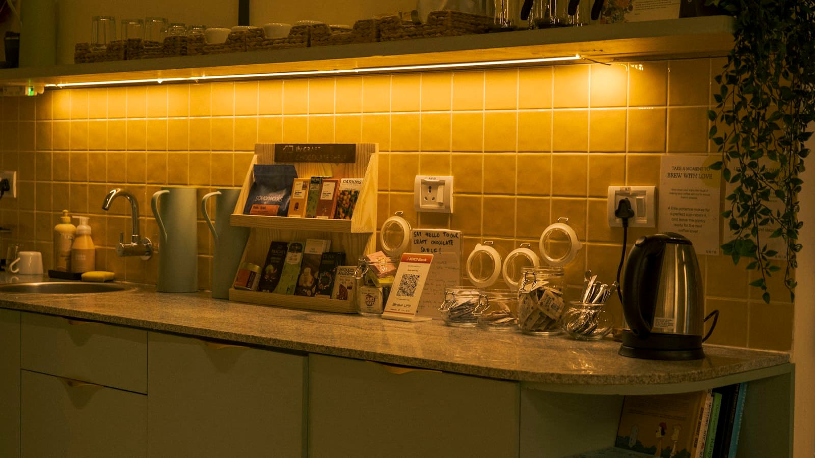 Office kitchenette counter with a kettle and supplies